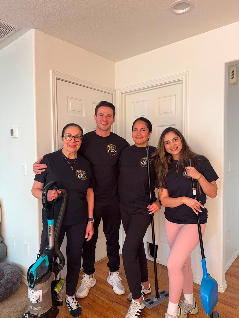 The Leo Cleaning Service LLC team with their cleaning equipment